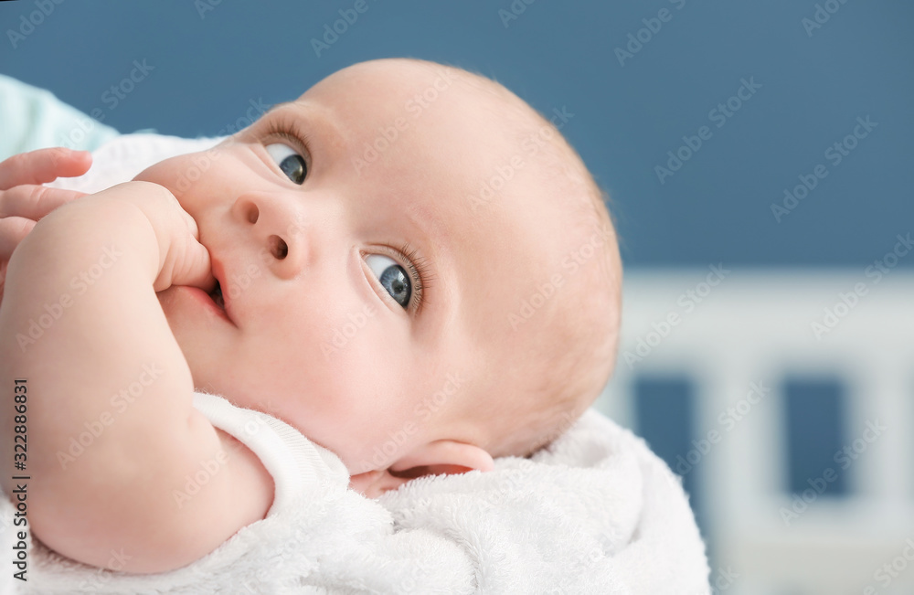 Young mother with little baby at home, closeup