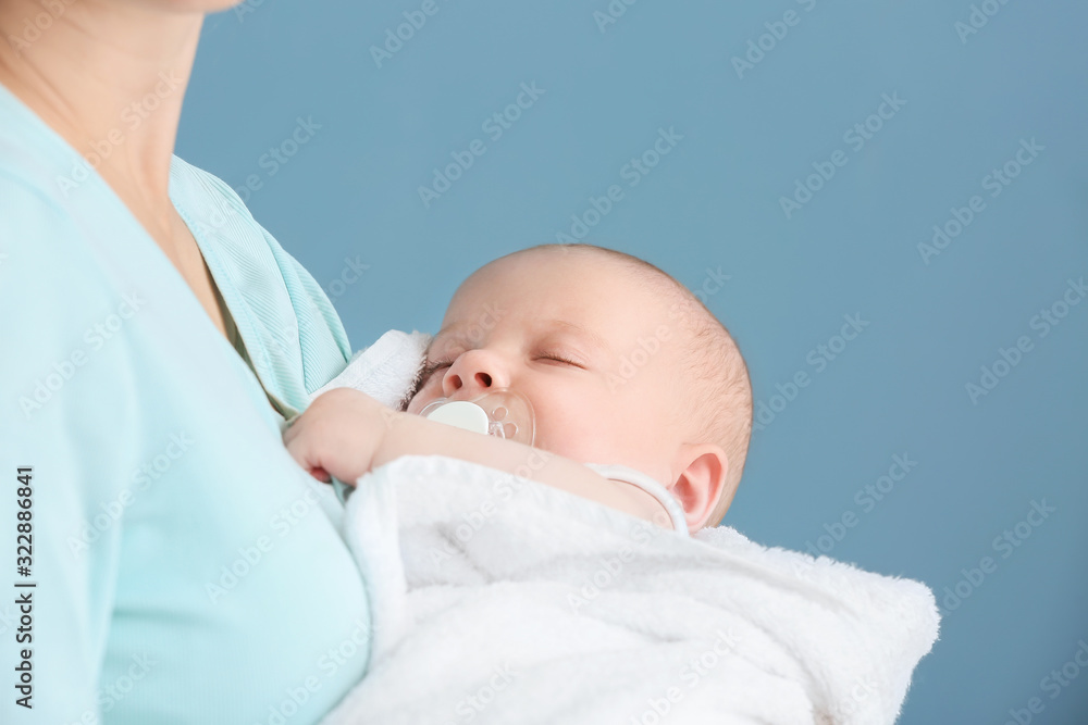 Young mother with little baby at home, closeup