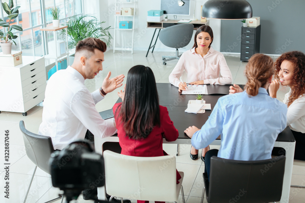 Human resources commission interviewing woman in office