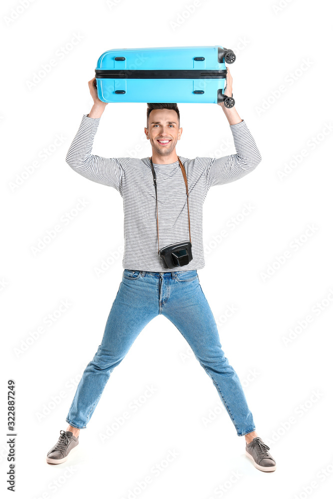 Male tourist with luggage on white background