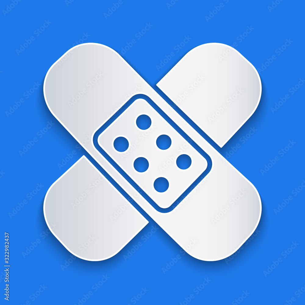 Paper cut Crossed bandage plaster icon isolated on blue background. Medical plaster, adhesive bandag