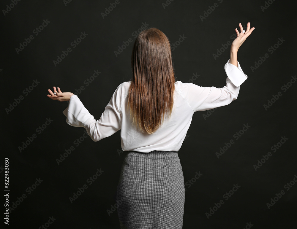 Helpless businesswoman on dark background. Concept of choice