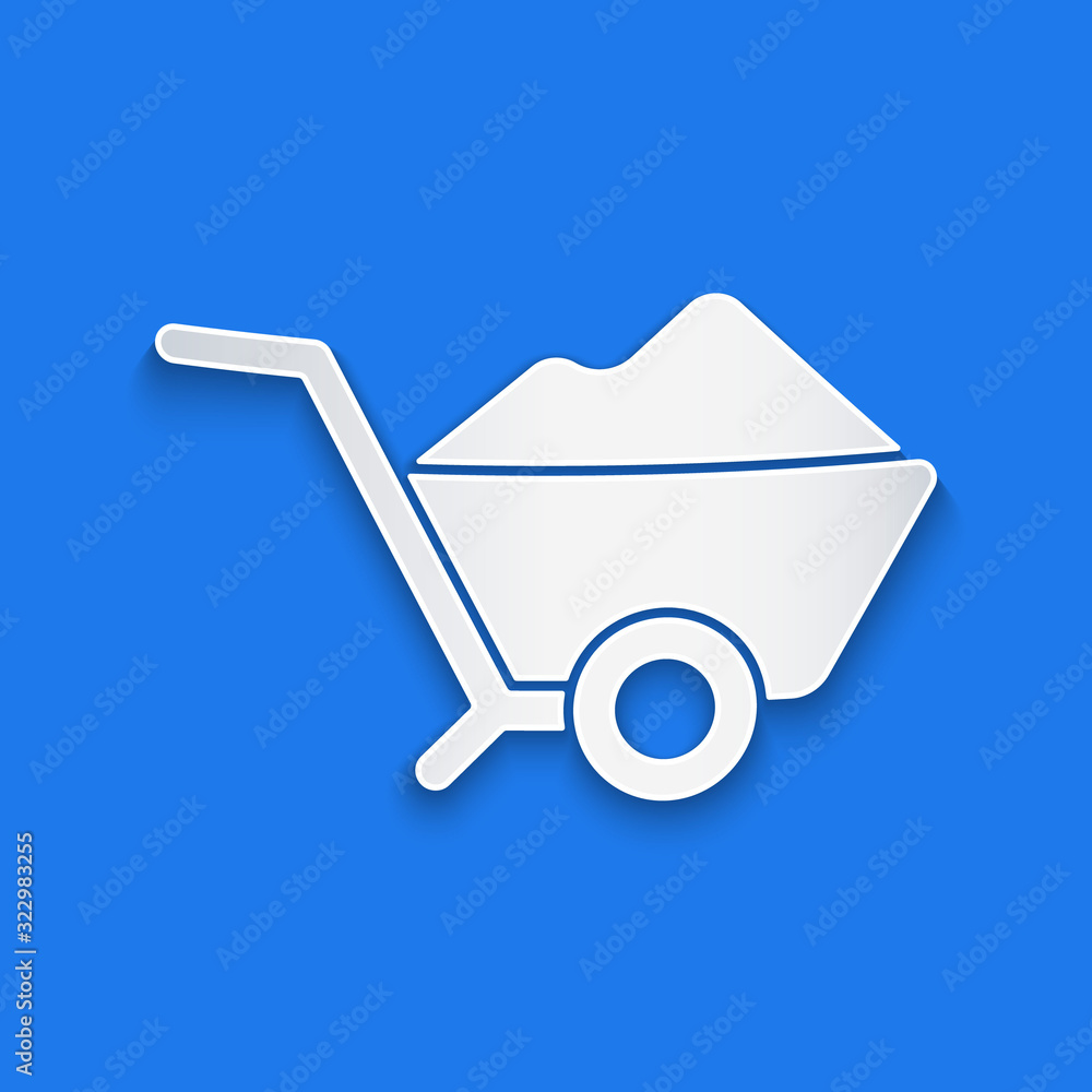 Paper cut Wheelbarrow with dirt icon isolated on blue background. Tool equipment. Agriculture cart w