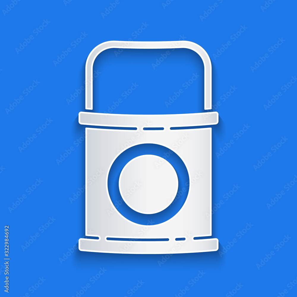 Paper cut Paint bucket icon isolated on blue background. Paper art style. Vector Illustration