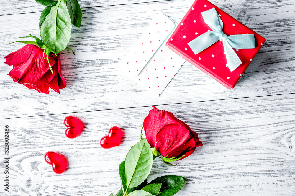 concept Valentines Day with flower wooden background top view