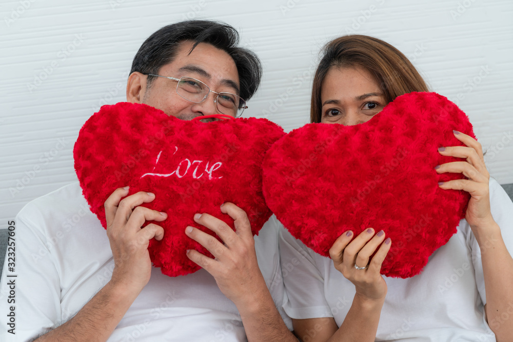 Happy Asian senior couple having good time at home. Old people retirement and healthy citizens elder