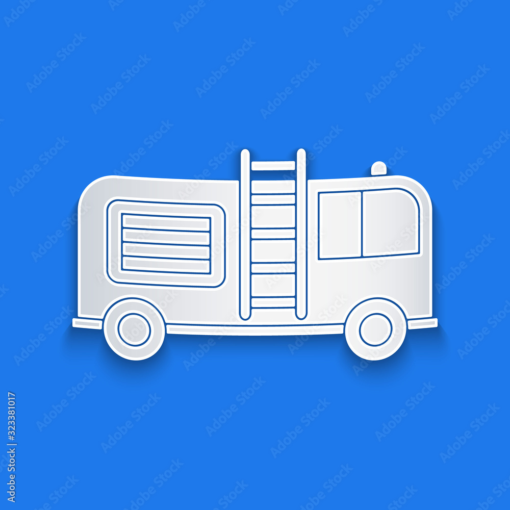 Paper cut Fire truck icon isolated on blue background. Fire engine. Firefighters emergency vehicle. 