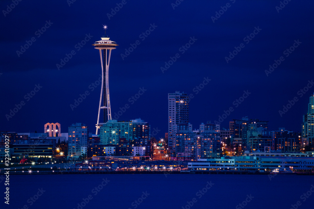 View of Seattle town at night over Elliot bay in front, WA, USA