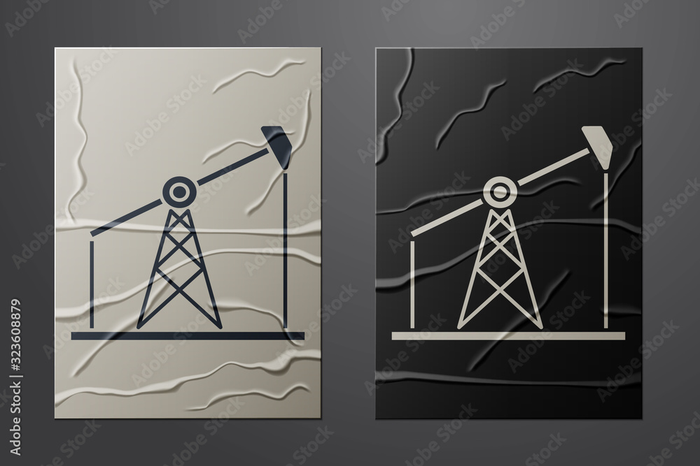 White Oil pump or pump jack icon isolated on crumpled paper background. Oil rig. Paper art style. Ve