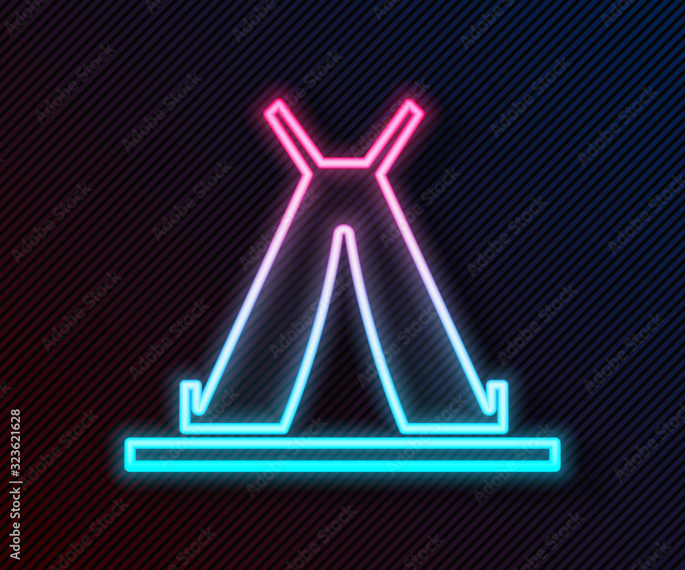 Glowing neon line Traditional indian teepee or wigwam icon isolated on black background. Indian tent