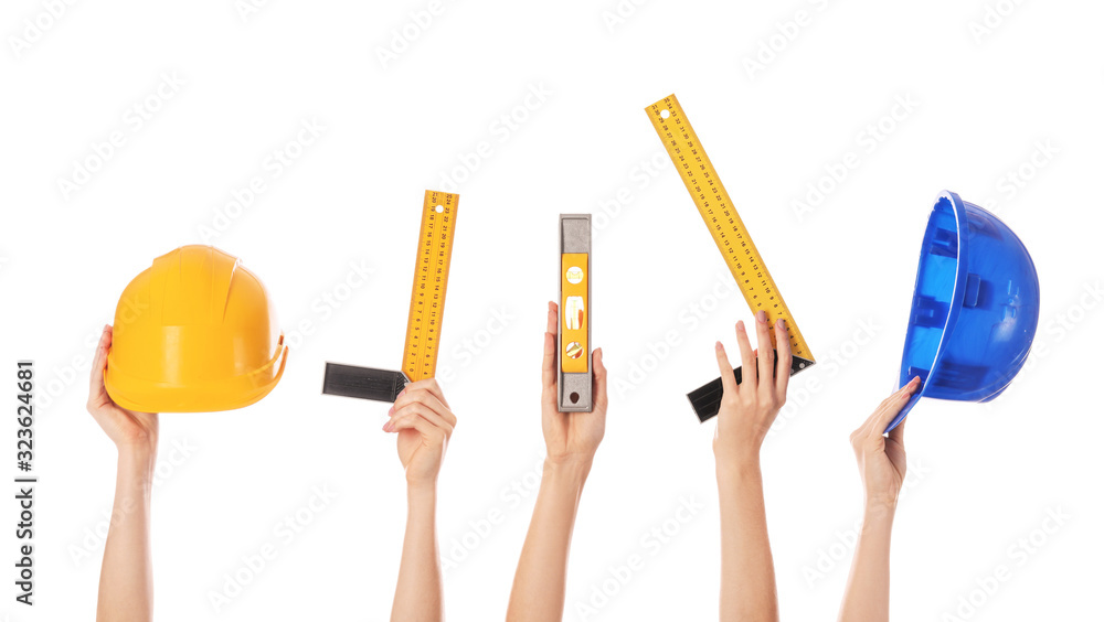 Many hands with architects supplies on white background