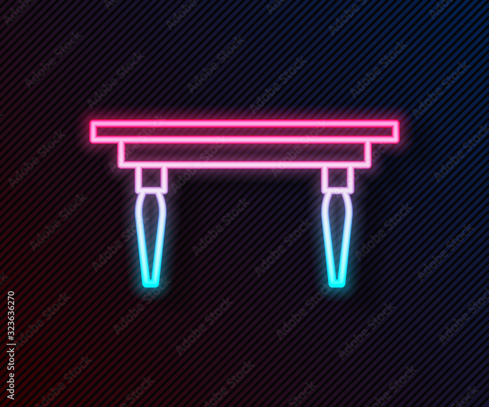 Glowing neon line Wooden table icon isolated on black background. Vector Illustration