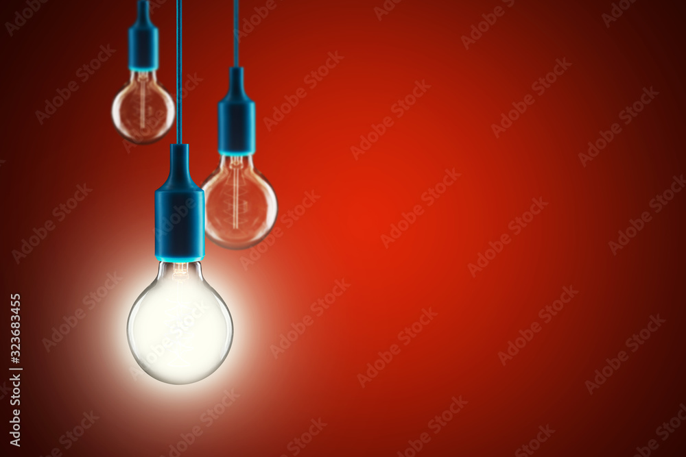 Idea and leadership concept - bulbs on the red background