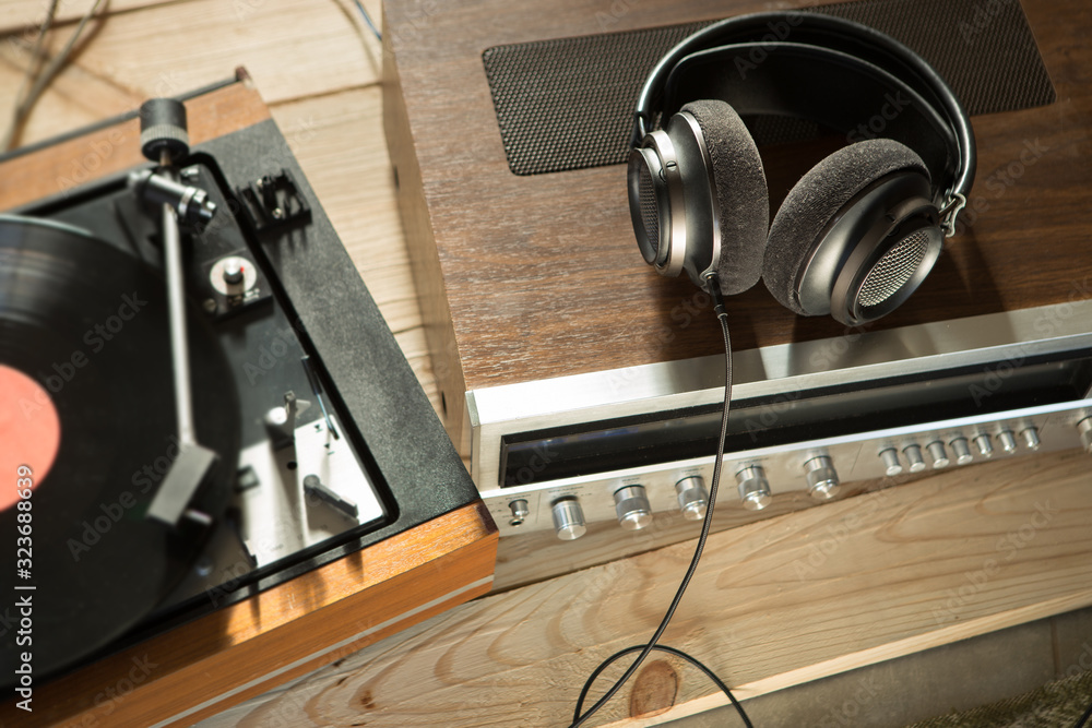 HiFi system with turntable, amplifier, headphones and lp vinyl records in a listening room