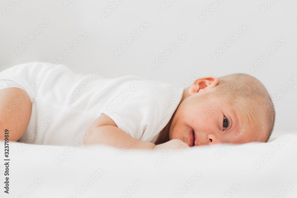 Portrait baby adorable on white bed, newborn concept