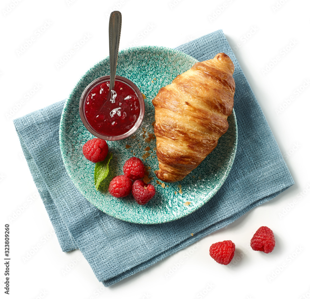 freshly baked croissant on blue plate