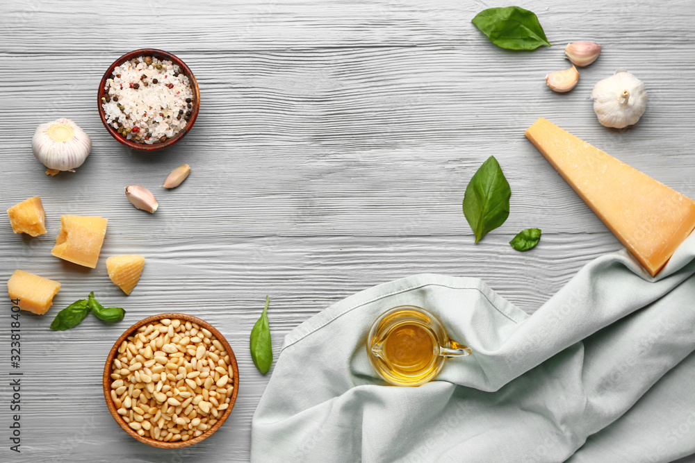 Ingredients for pesto sauce on wooden background