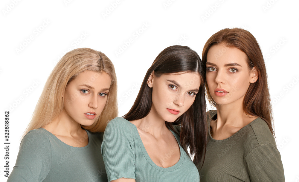 Young women with beautiful makeup on white background