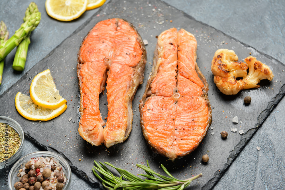 Composition with fried salmon on table