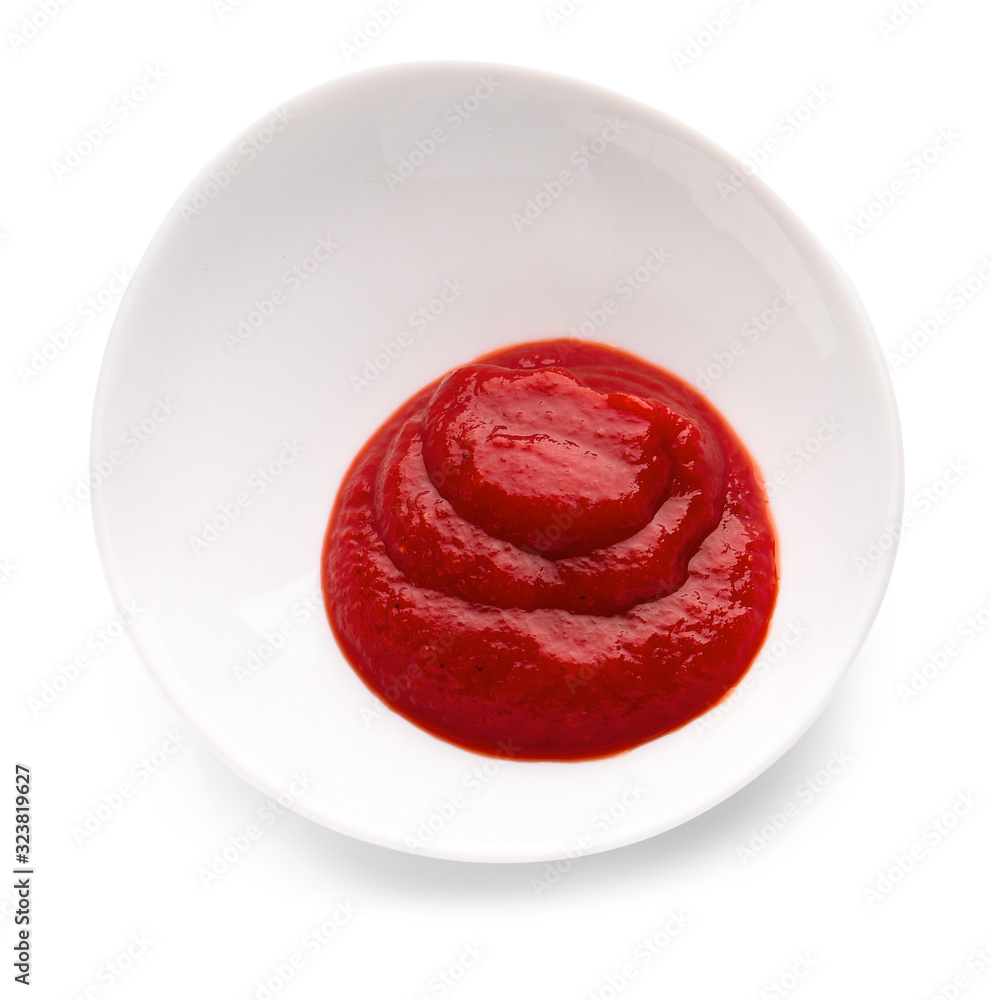 Plate with tasty tomato sauce on white background