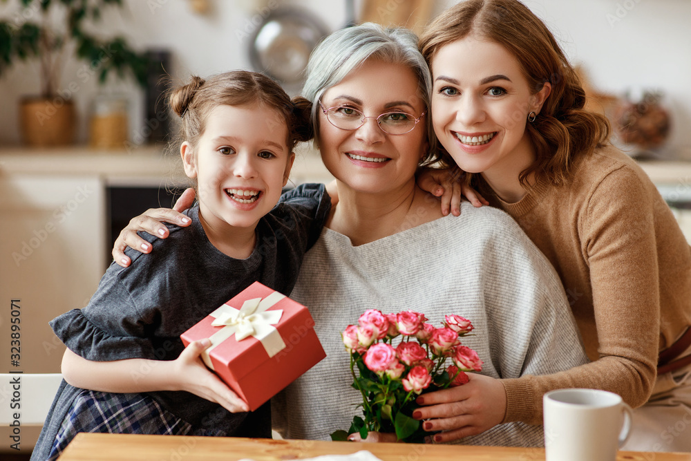 mothers day! three generations of  family mother, grandmother and daughter congratulate on the holi