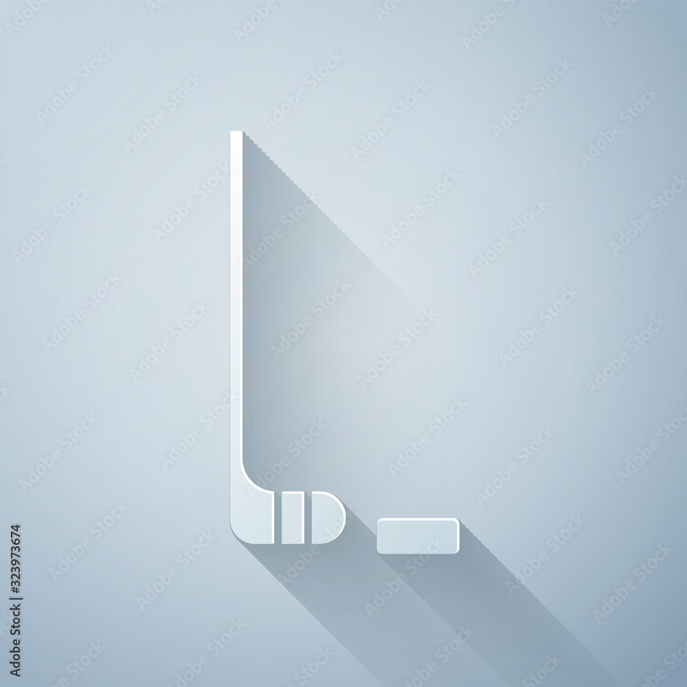 Paper cut Ice hockey stick and puck icon isolated on grey background. Paper art style. Vector Illust