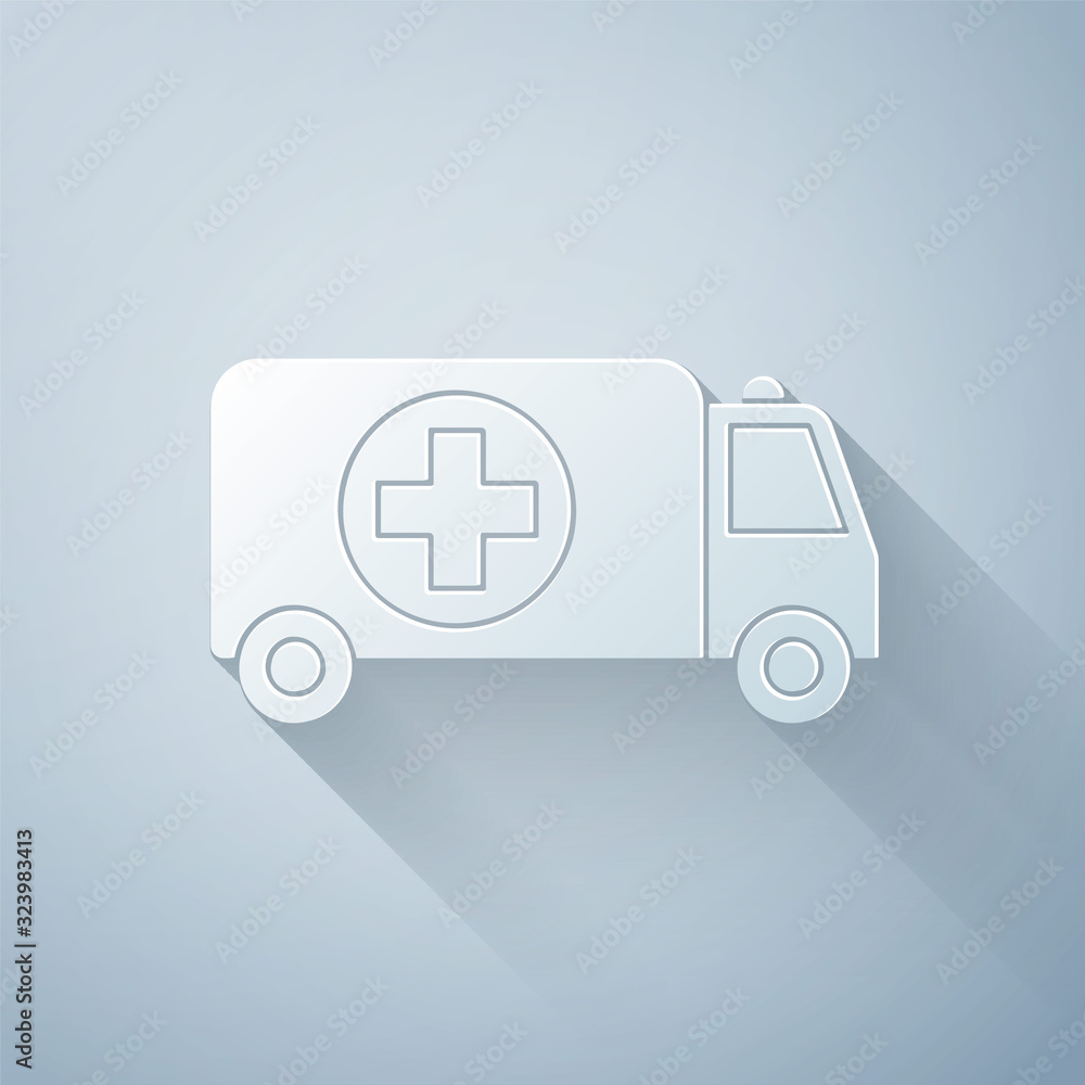 Paper cut Ambulance and emergency car icon isolated on grey background. Ambulance vehicle medical ev