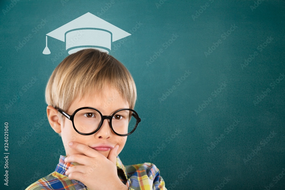 Smart educated school kid student with drawing graduation hat