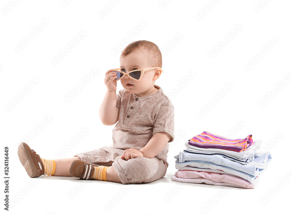 Cute baby with stylish clothes on white background