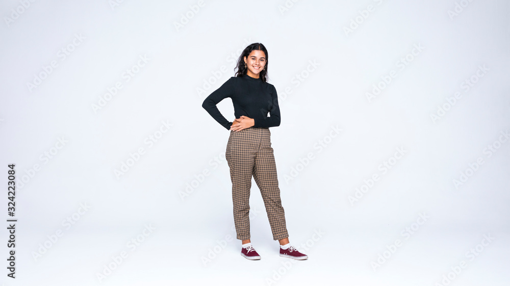 Young woman standing with hands on waist