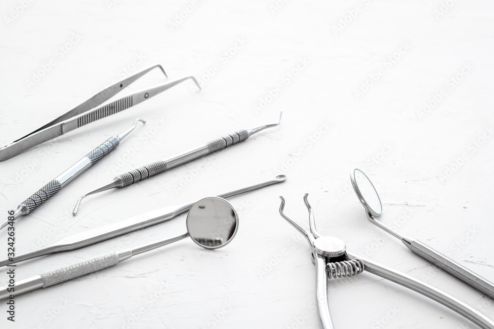 Dental instruments - set with mirrors - on white background close up space for text