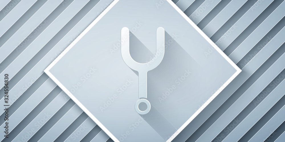 Paper cut Musical tuning fork for tuning musical instruments icon isolated on grey background. Paper