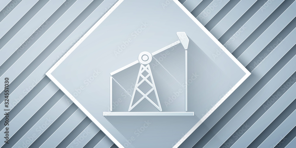 Paper cut Oil pump or pump jack icon isolated on grey background. Oil rig. Paper art style. Vector I