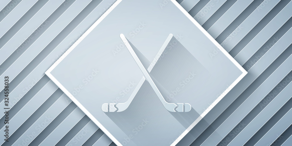 Paper cut Ice hockey sticks icon isolated on grey background. Paper art style. Vector Illustration