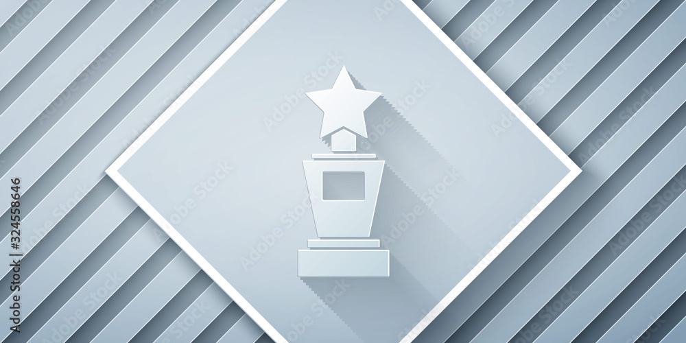 Paper cut Award cup icon isolated on grey background. Winner trophy symbol. Championship or competit