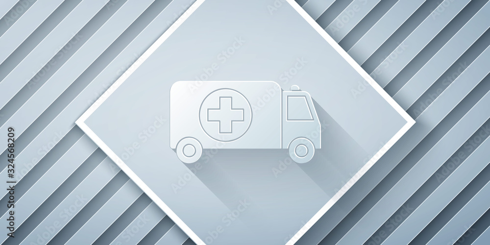 Paper cut Ambulance and emergency car icon isolated on grey background. Ambulance vehicle medical ev