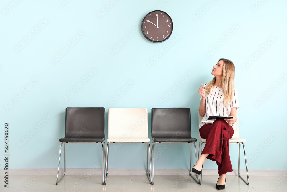 Young woman waiting for job interview indoors