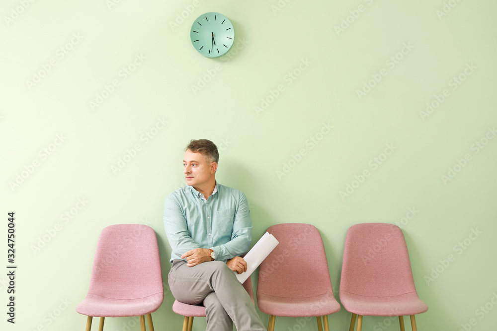 Mature man waiting for job interview indoors