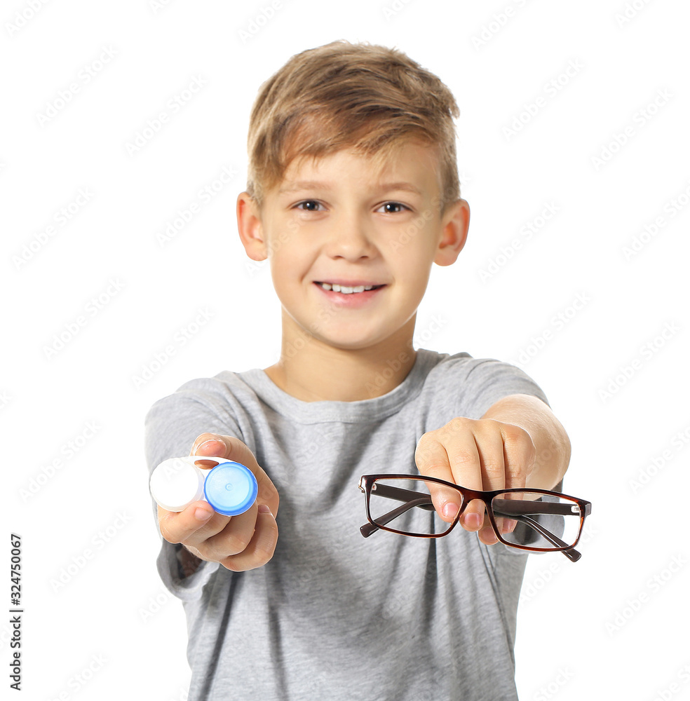 Little boy with contact lens case and eyeglasses on white background