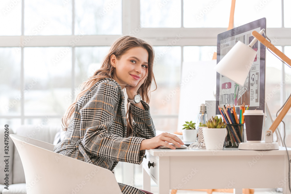 Female interior designer working in office