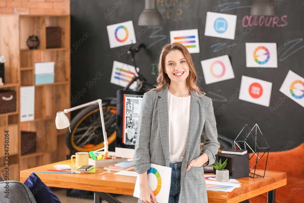 Portrait of female interior designer in office