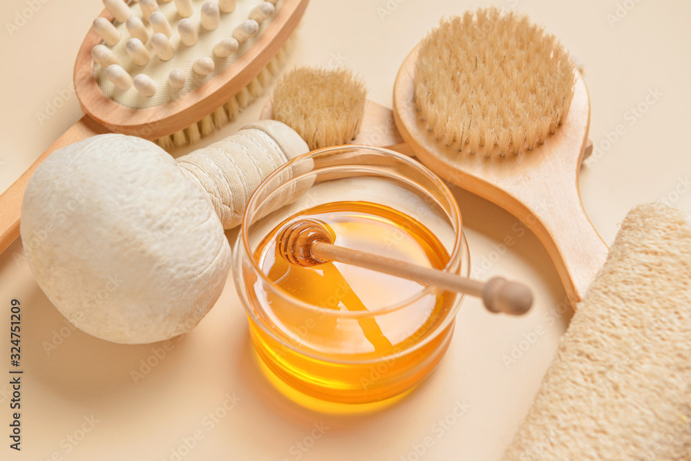 Composition with spa items and honey on color background