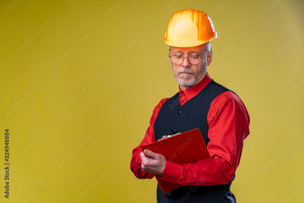 Serious general contractor or real estate investor concept with elegant man with beard, glasses and 