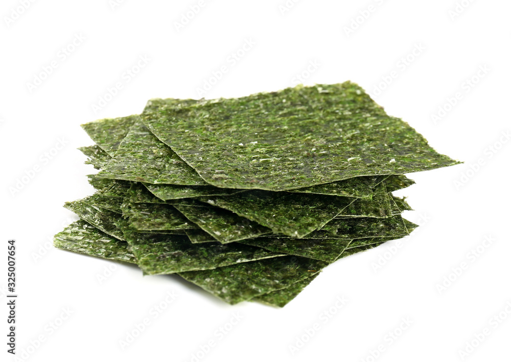 Tasty seaweed sheets on white background