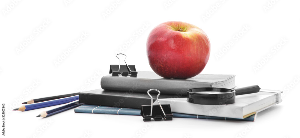 Set of school supplies and apple on white background