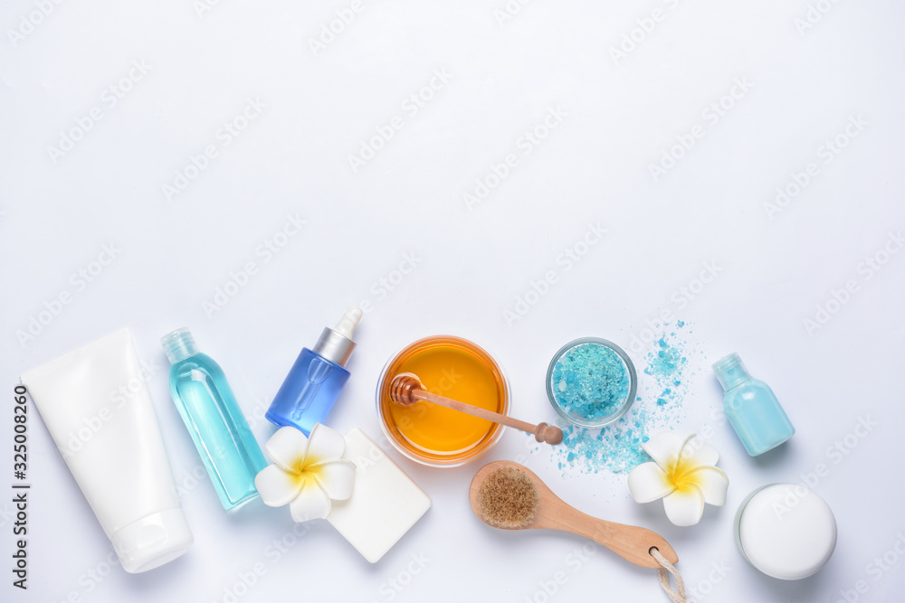 Composition with spa items and honey on white background