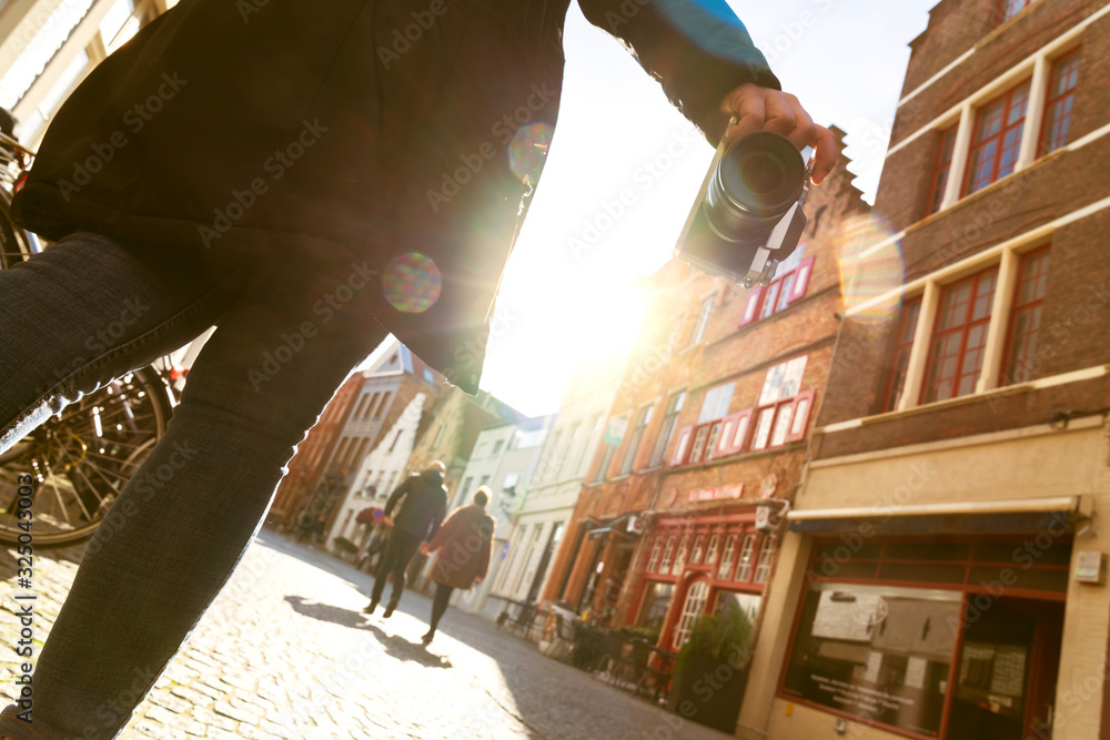 closeup asian woman hand hold retro camera traveller with background of old tradition architecture,a