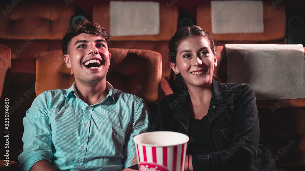 People audience watching movie in the movie theater cinema. Group recreation activity and entertainm