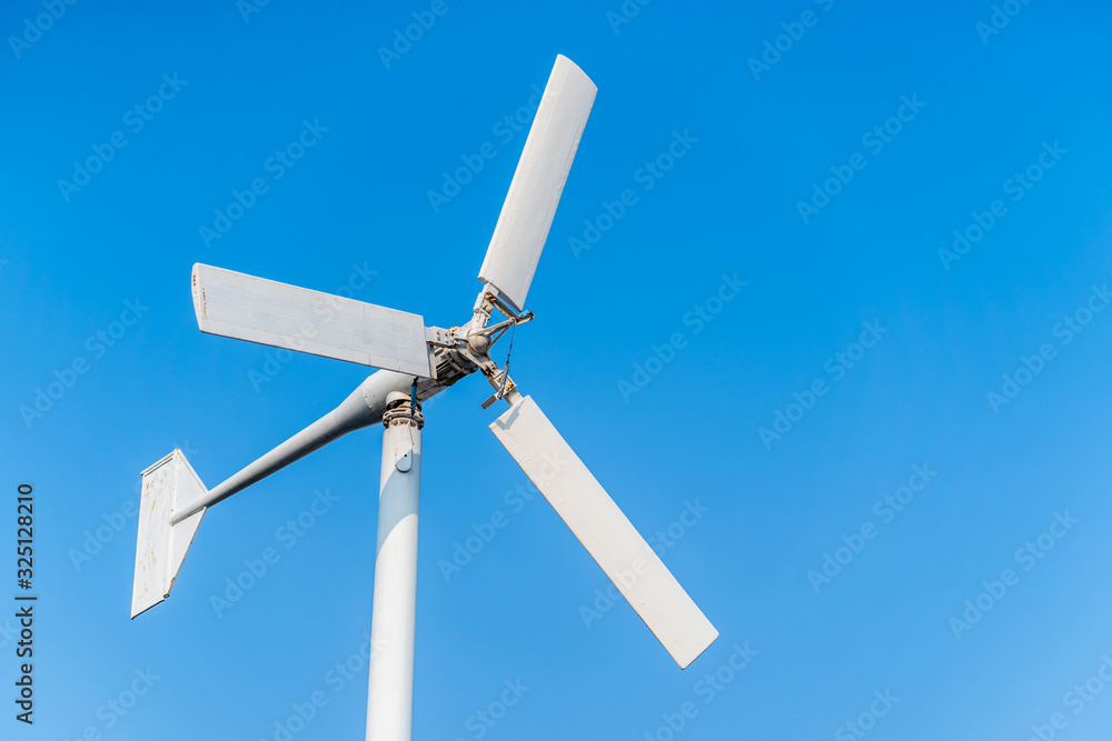 wind turbine against blue sky