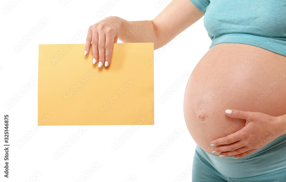 Pregnant woman holding paper sign over white